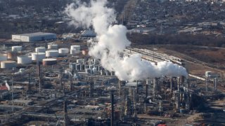 An emission comes out of a smoke stack at the Phillips 66 Refinery on February 6, 2024, in Linden, New Jersey.