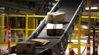 Amazon parcels are prepared for delivery at Amazon’s Robotic Fulfillment Centre.