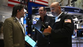 Traders work on the floor of the New York Stock Exchange (NYSE) during morning trading in New York on August 23, 2024. 