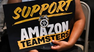 An attendee holds a “Support Amazon Teamsters” sign during a rally with workers and union members as part of an “Amazon Teamsters Day of Solidarity” in support of the unionization and collective bargaining of Amazon delivery drivers at the Teamsters Local 848 in Long Beach, California, on Aug. 29, 2024.