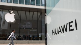 The Huawei flagship store and the Apple flagship store are seen at Nanjing Road Pedestrian Street in Shanghai, China, September 2, 2024. 