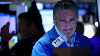 Traders work on the floor at the New York Stock Exchange on Aug. 30, 2024.