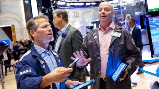 Traders work on the floor of the New York Stock Exchange.