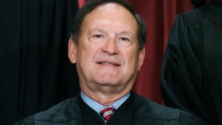 FILE – Associate Justice Samuel Alito joins other members of the Supreme Court as they pose for a new group portrait, Oct. 7, 2022, at the Supreme Court building in Washington.