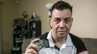 New York City Police Department officer Mathew Bianchi holds a Police Benevolent Association "courtesy card."