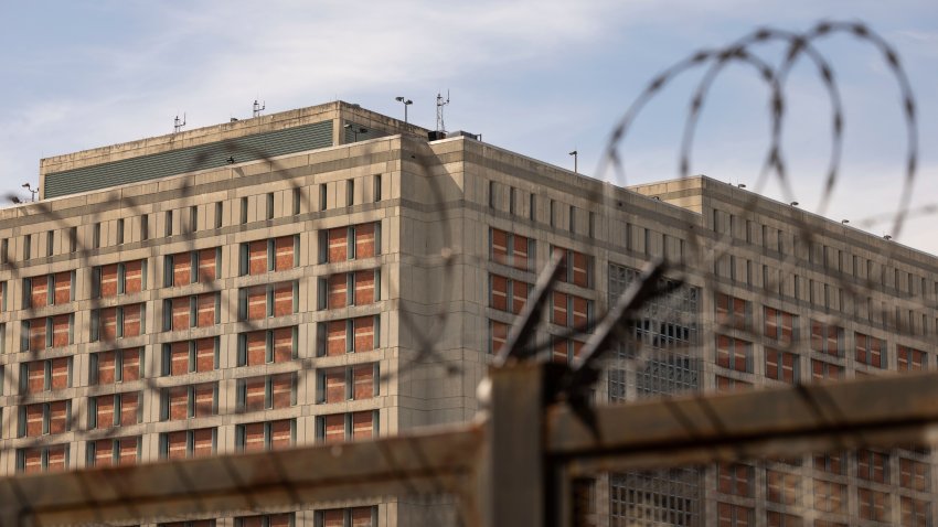 The Metropolitan Detention Center is seen through barb wire in the Sunset Park neighborhood of the Brooklyn borough of New York, Thursday, Sept. 19, 2024.