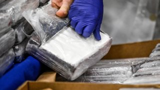 File photos of seized cocaine bricks. (Photo by PATRICIA DE MELO MOREIRA / AFP) (Photo by PATRICIA DE MELO MOREIRA/AFP via Getty Images)