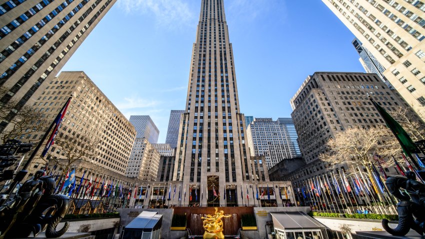 A view of 30 Rockefeller with the gold statue of "Prometheus" in the bottom and the ice skating rink in Rockefeller Center.