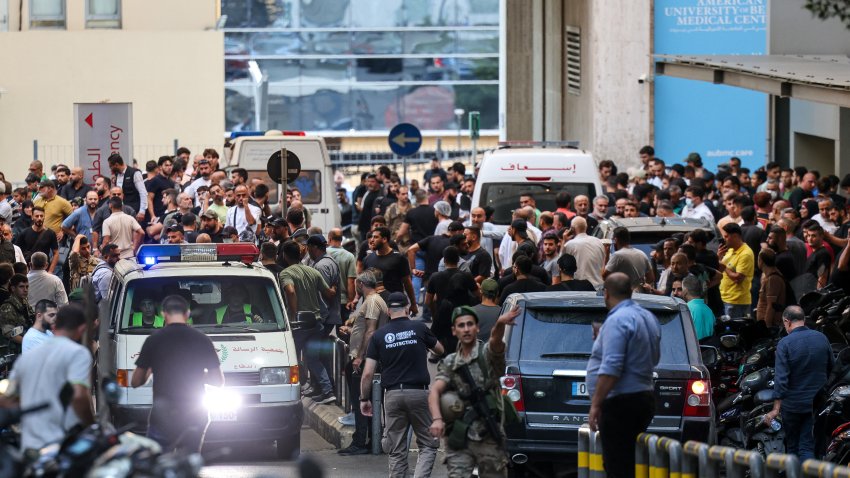 Ambulances are surrounded by people at the entrance of the American University of Beirut Medical Center, on September 17, 2024, after explosions hit locations in several Hezbollah strongholds around Lebanon amid ongoing cross-border tensions between Israel and Hezbollah fighters.