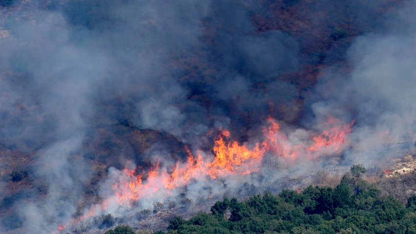 Flames and smoke rise from an Israeli airstrike on the Mahmoudieh mountain, as seen from Marjayoun town, south Lebanon, Tuesday, Sept. 24, 2024.