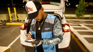 Amazon Flex driver Ricardo Escalona works to deliver his same-day orders during Cyber Monday from an Amazon fulfillment center in Tampa, Florida, on Nov. 27, 2023.