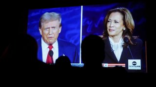 Former President Donald Trump and Vice President Kamala Harris are shown on screen during a debate watch party at the Cameo Art House Theatre in Fayetteville, North Carolina, on Sept. 10, 2024.