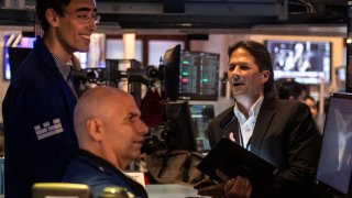 Traders work on the floor of the New York Stock Exchange on Sept. 18, 2024.