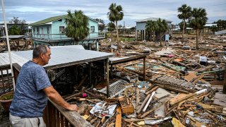 David Hester inspects damage to his house after Hurricane Helene made landfall, in Horseshoe Beach, Florida, Sept. 28, 2024.