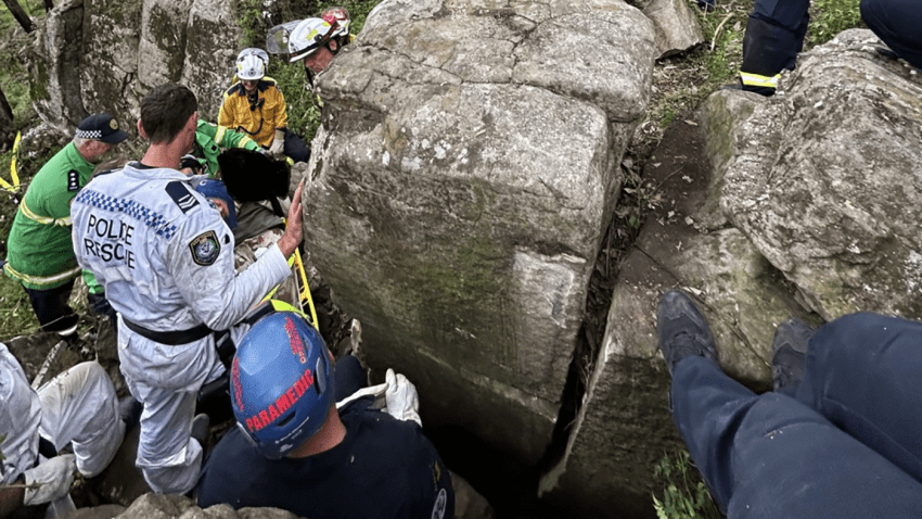 Workers rescue a woman