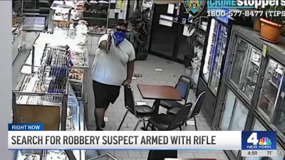 Search for Queens robbery suspect armed with rifle