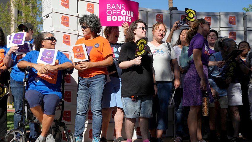 FILE - Arizona abortion-rights supporters gather for a news conference prior to delivering over 800,000 petition signatures to the capitol to get abortion rights on the November general election ballot Wednesday, July 3, 2024, in Phoenix.