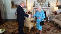 Queen Elizabeth II welcomes newly elected leader of the Conservative party, Boris Johnson during an audience where she invited him to become Prime Minister and form a new government in Buckingham Palace on July 24, 2019 in London, England.