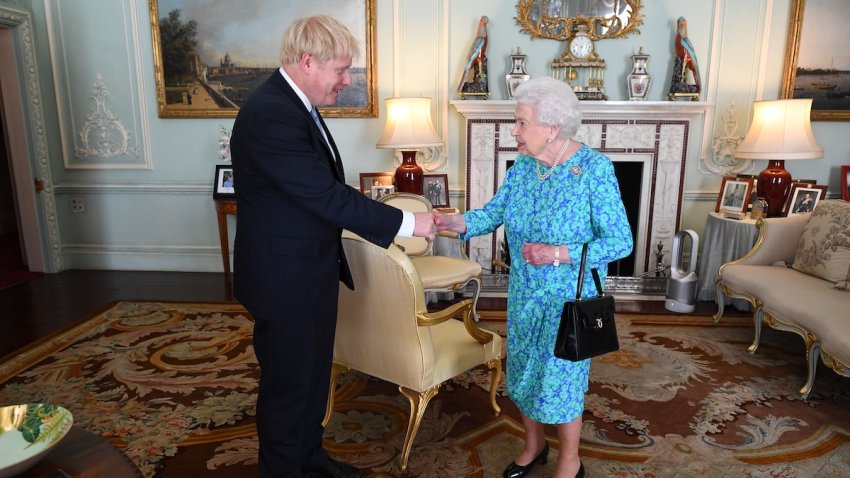 Queen Elizabeth II welcomes newly elected leader of the Conservative party, Boris Johnson during an audience where she invited him to become Prime Minister and form a new government in Buckingham Palace on July 24, 2019 in London, England.