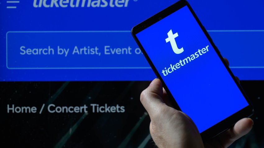 The Ticketmaster logo is being displayed on a smartphone with the Ticketmaster web home page visible in the background, in this photo illustration in Brussels, Belgium, on June 2, 2024.