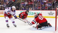 NEWARK, NEW JERSEY – SEPTEMBER 30: Adam Sykora #38 of the New York Rangers is stopped by Jeremy Brodeur #60 of the New Jersey Devils in the first period of a preseason game at Prudential Center on September 30, 2024 in Newark, New Jersey. (Photo by Andrew Mordzynski/Getty Images)