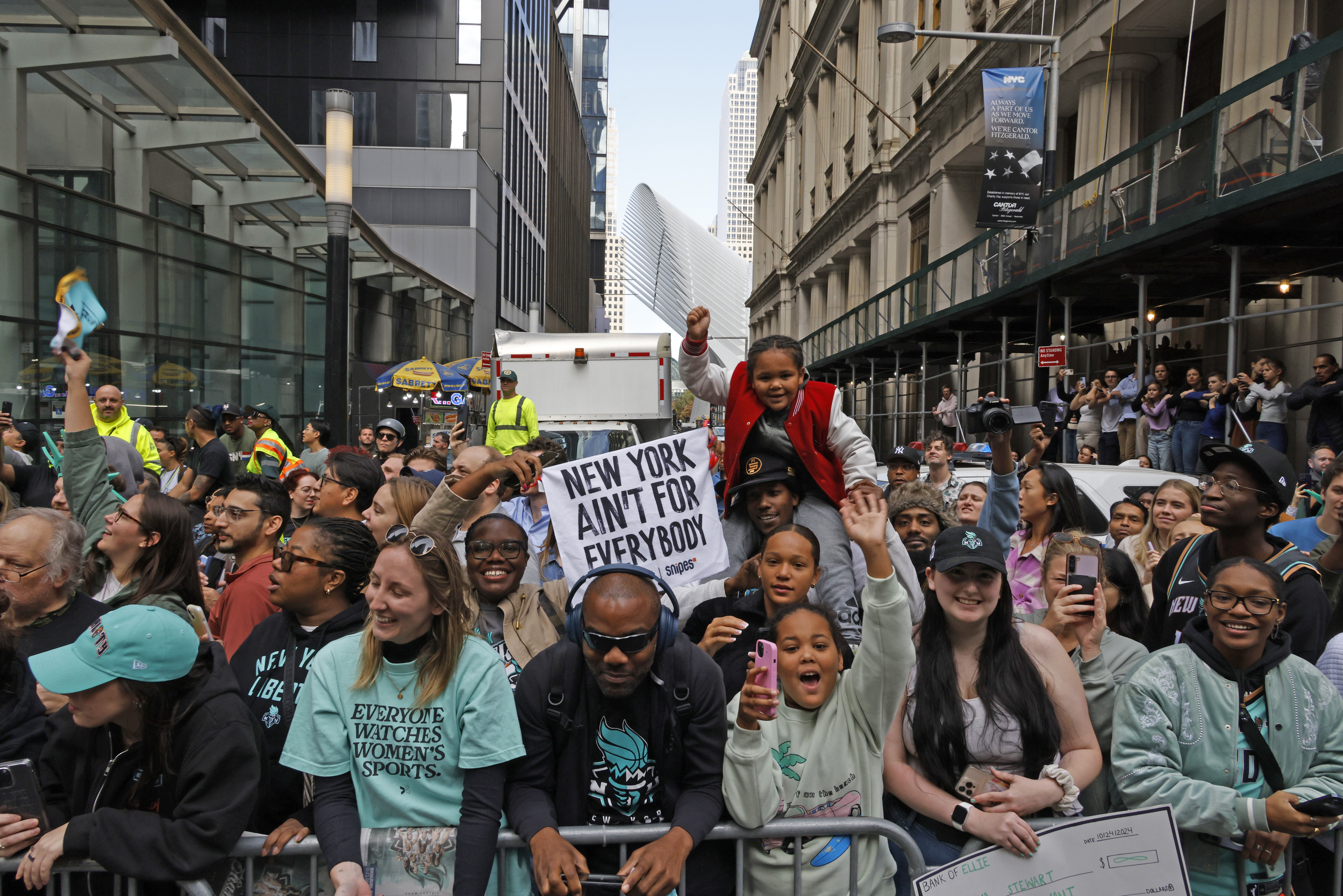 NEW YORK, NEW YORK – OCTOBER 24: Fans attend the New York Liberty Ticker Tape Victory Parade & Rally on October 24, 2024 in New York City. (Photo by Rob Kim/Getty Images)