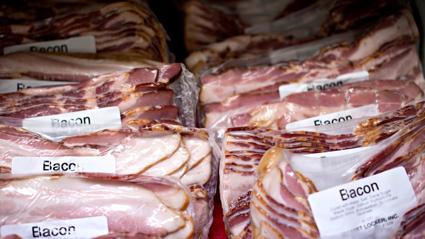 Shrink wrapped packages of sliced bacon sit on display at the Wyanet Locker Inc. facility in Wyanet, Illinois, U.S., on Thursday, Aug. 14, 2014. Declining supplies of pigs that resulted from a deadly virus that spread across 30 states since the outbreak began last year have pushed up retail-bacon prices 10 percent in 2014 to $6.106 a pound in June, the highest since at least 1980. Photographer: Daniel Acker/Bloomberg via Getty Images