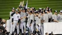 NEW YORK - NOVEMBER 4:  Derek Jeter #2 of the New York Yankees holds the Commissioner's Trophy after the Yankees defeated the Philadelphia Phillies in Game Six of the 2009 World Series November 4, 2009 at Yankee Stadium in the Bronx borough of New York City. The Yankees won the series 4-2. (Photo by Focus on Sport/Getty Images)