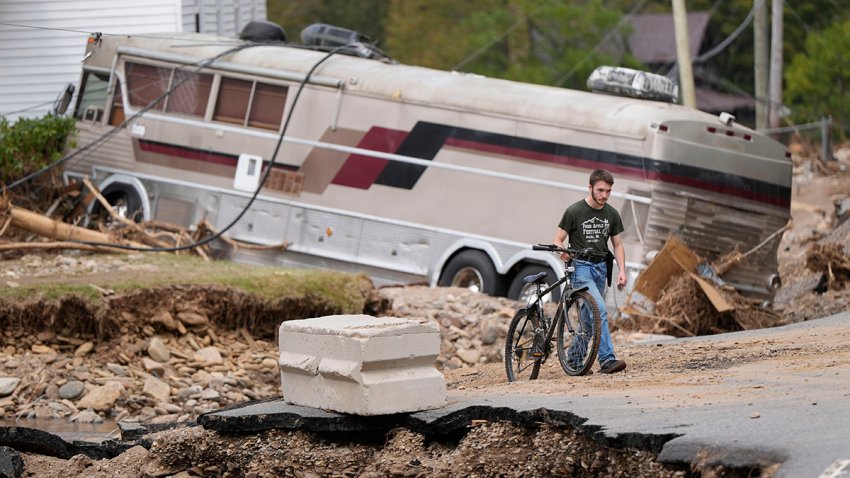 Dominick Gucciardo walks to his home in the aftermath of Hurricane Helene, Thursday, Oct. 3, 2024, in Pensacola, N.C.