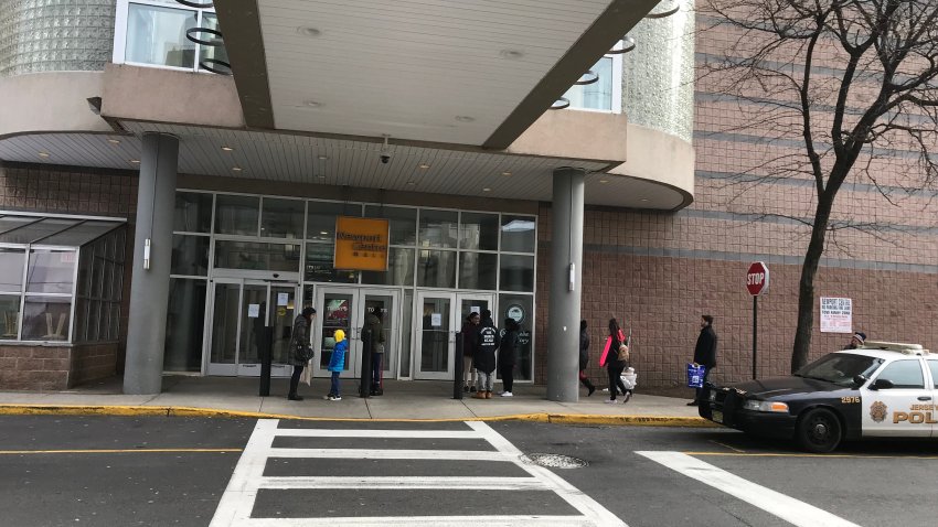 People gather outside Newport Centre mall in Jersey City waiting for it to open Jan. 12, 2019.