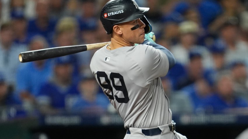 Oct 10, 2024; Kansas City, Missouri, USA; New York Yankees outfielder Aaron Judge (99) hits a double during the sixth inning against the Kansas City Royals during game four of the ALDS for the 2024 MLB Playoffs at Kauffman Stadium. Mandatory Credit: Jay Biggerstaff-Imagn Images