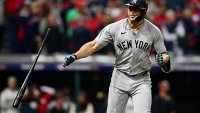 Oct 19, 2024; Cleveland, Ohio, USA; New York Yankees designated hitter Giancarlo Stanton (27) celebrates after hitting a two run home run during the sixth inning against the Cleveland Guardians during game five of the ALCS for the 2024 MLB playoffs at Progressive Field. Mandatory Credit: David Dermer-Imagn Images