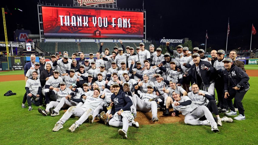 Oct 19, 2024; Cleveland, Ohio, USA; The New York Yankees celebrates after beating the Cleveland Guardians during game five of the ALCS for the 2024 MLB playoffs at Progressive Field. Mandatory Credit: Scott Galvin-Imagn Images