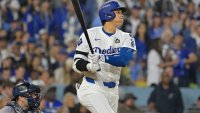 Oct 25, 2024; Los Angeles, California, USA; Los Angeles Dodgers designated hitter player Shohei Ohtani (17) hits a double in the eighth inning against the New York Yankees during game one of the 2024 MLB World Series at Dodger Stadium. Mandatory Credit:  Jayne Kamin-Oncea-Imagn Images