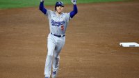 Oct 28, 2024; New York, New York, USA; Los Angeles Dodgers first baseman Freddie Freeman (5) celebrates after hitting a two-run home run during the first inning in game three of the 2024 MLB World Series against the New York Yankees at Yankee Stadium. Mandatory Credit: Vincent Carchietta-Imagn Images