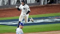 Oct 29, 2024; Bronx, New York, USA; New York Yankees shortstop Anthony Volpe (11) reacts after hitting a grand slam against the Los Angeles Dodgers in the third inning during game four of the 2024 MLB World Series at Yankee Stadium. Mandatory Credit: Robert Deutsch-Imagn Images