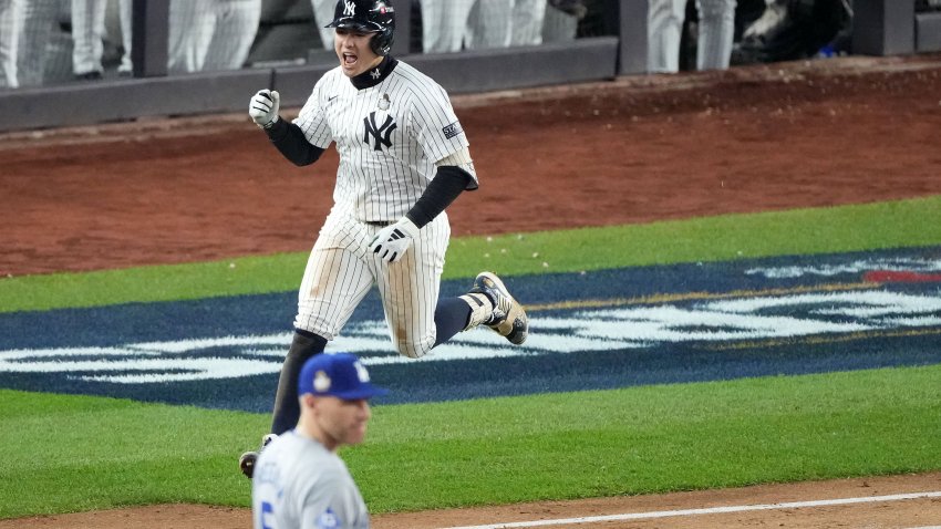 Oct 29, 2024; Bronx, New York, USA; New York Yankees shortstop Anthony Volpe (11) reacts after hitting a grand slam against the Los Angeles Dodgers in the third inning during game four of the 2024 MLB World Series at Yankee Stadium. Mandatory Credit: Robert Deutsch-Imagn Images