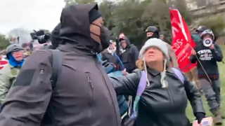 Dana Jean Bell, assaulting news reporters and others on north lawn, on Jan. 6, 2021.