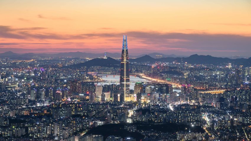 A general view of the Lotte tower amid the the Seoul city skyline and Han river during sunset.