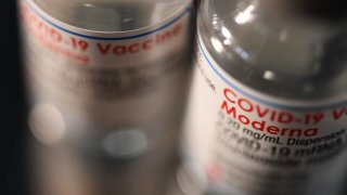 Empty bottles of Moderna’s Covid-19 vaccine.