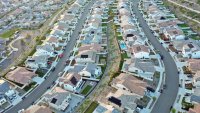 An aerial view of existing homes near new homes under construction (UPPER R) in the Chatsworth neighborhood on September 08, 2023 in Los Angeles, California. 