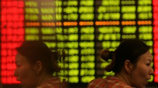 An investor reacts as she views the stock index at a securities company on May 30, 2007 in Shanghai, China.