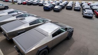 New Tesla Cybertruck vehicles parked at a logistics drop zone in Seattle on Aug. 22, 2024.