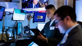 Traders work on the floor of the New York Stock Exchange. 