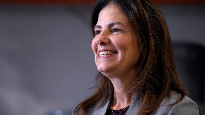 FILE – Republican gubernatorial candidate Kelly Ayotte, who faces Democrat Joyce Craig in the November 2024 election, smiles during a visit to a local concrete coating business, Wednesday, Oct. 16, 2024, in Manchester, N.H. (AP Photo/Charles Krupa, File)