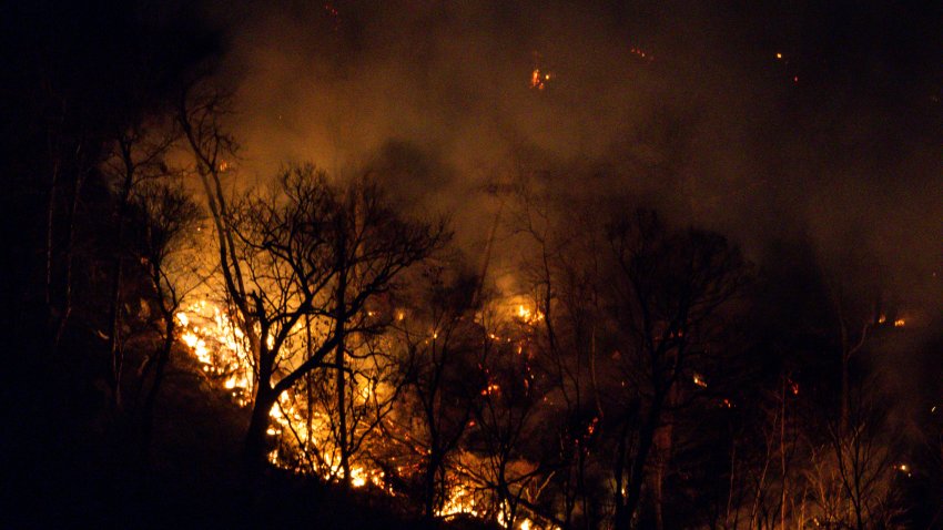 Wildfires burn along the New York and New Jersey border in Greenwood Lake, New York, Wednesday, Nov. 13, 2024. (AP Photo/Eduardo Munoz Alvarez)