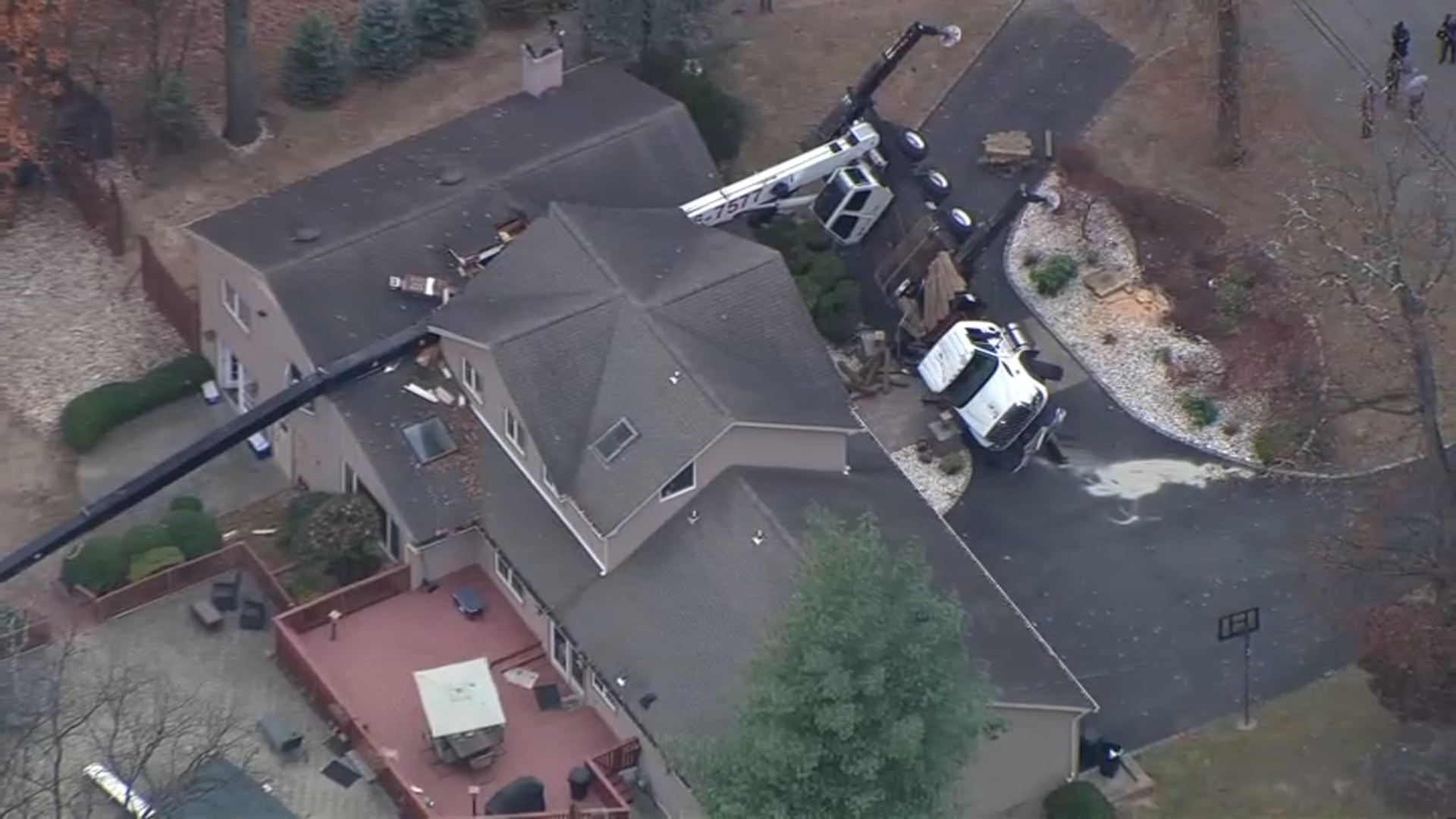 Crane topples over onto house in New Jersey Crane topples over onto house in New Jersey
