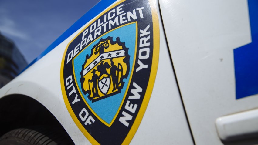 A New York City Police Department (NYPD) logo is displayed on the side of a vehicle in the Tribeca neighborhood of New York, U.S., on Wednesday, June 17, 2020. With two weeks to get City Council approval of a spending plan that plugs a $9 billion revenue gap in the next two years, Mayor Bill de Blasio faces renewed calls to slash more than $1 billion from the NYPD. Photographer: Angus Mordant/Bloomberg via Getty Images