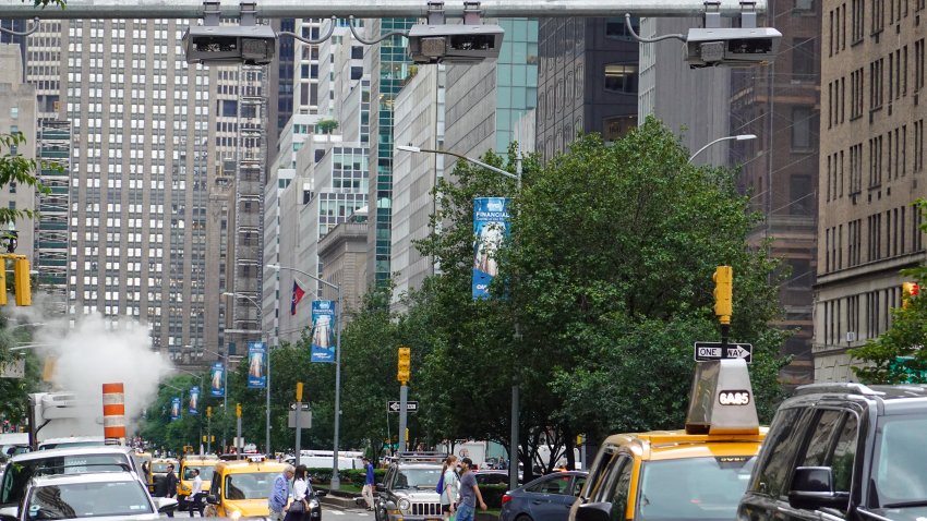 NEW YORK, NY – JUNE 11: Vehicles drive under the congestion pricing facilities on June 11, 2024 in New York City. New York City’s congestion pricing plan has been ‘indefinitely’ delayed by New York Governor Kathy Hochul on June 12, which is originally planned to be implemented on June 30.