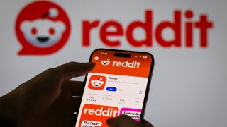 CHONGQING, CHINA – OCTOBER 27: The Reddit app page is displayed on a smartphone in the Apple App Store in front of the Reddit logo on October 27, 2024 in Chongqing, China.